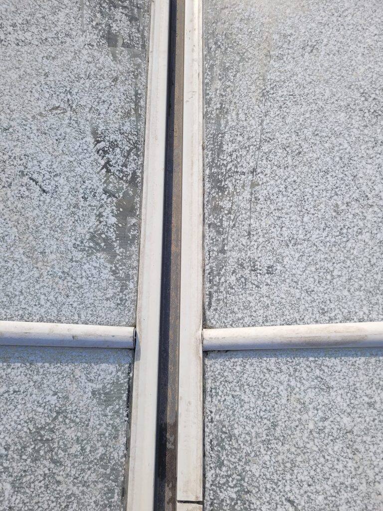 Greenhouse gutter cleaning and maintenance