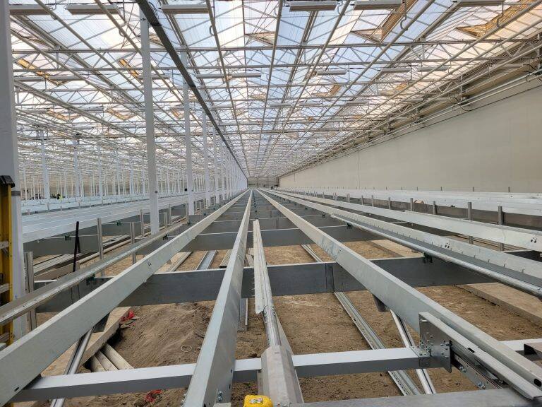 Greenhouse steel frame construction by VGB Workers