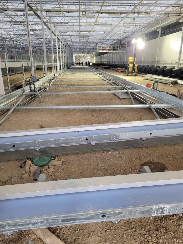Greenhouse steel frame construction by VGB Workers
