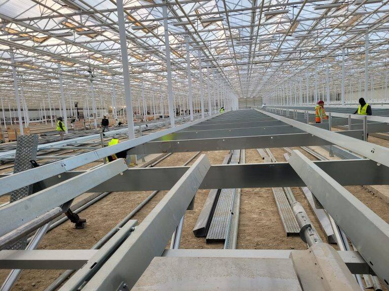 Greenhouse steel frame construction by VGB Workers