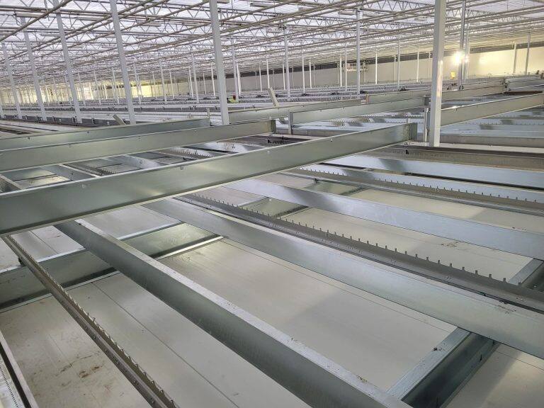 Greenhouse steel frame construction by VGB Workers