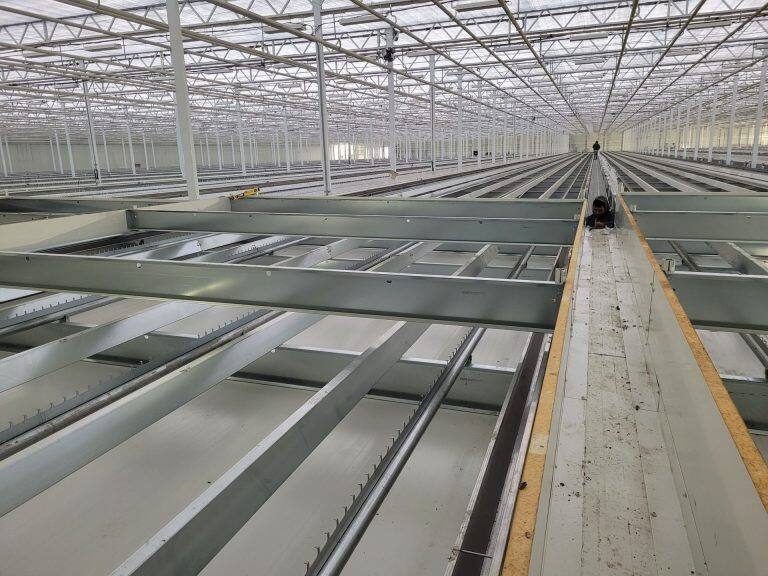 Greenhouse steel frame construction by VGB Workers