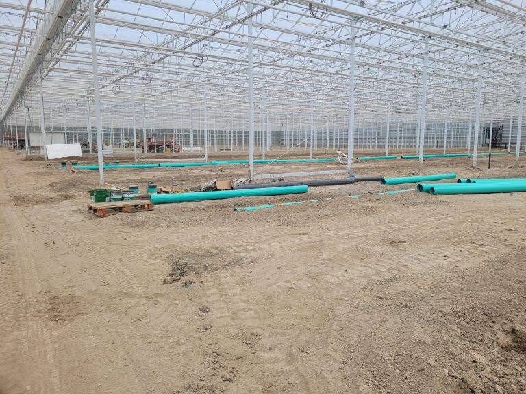 Greenhouse steel frame construction by VGB Workers