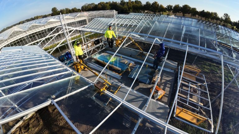 Specialized greenhouse construction machinery operated by VGB Workers