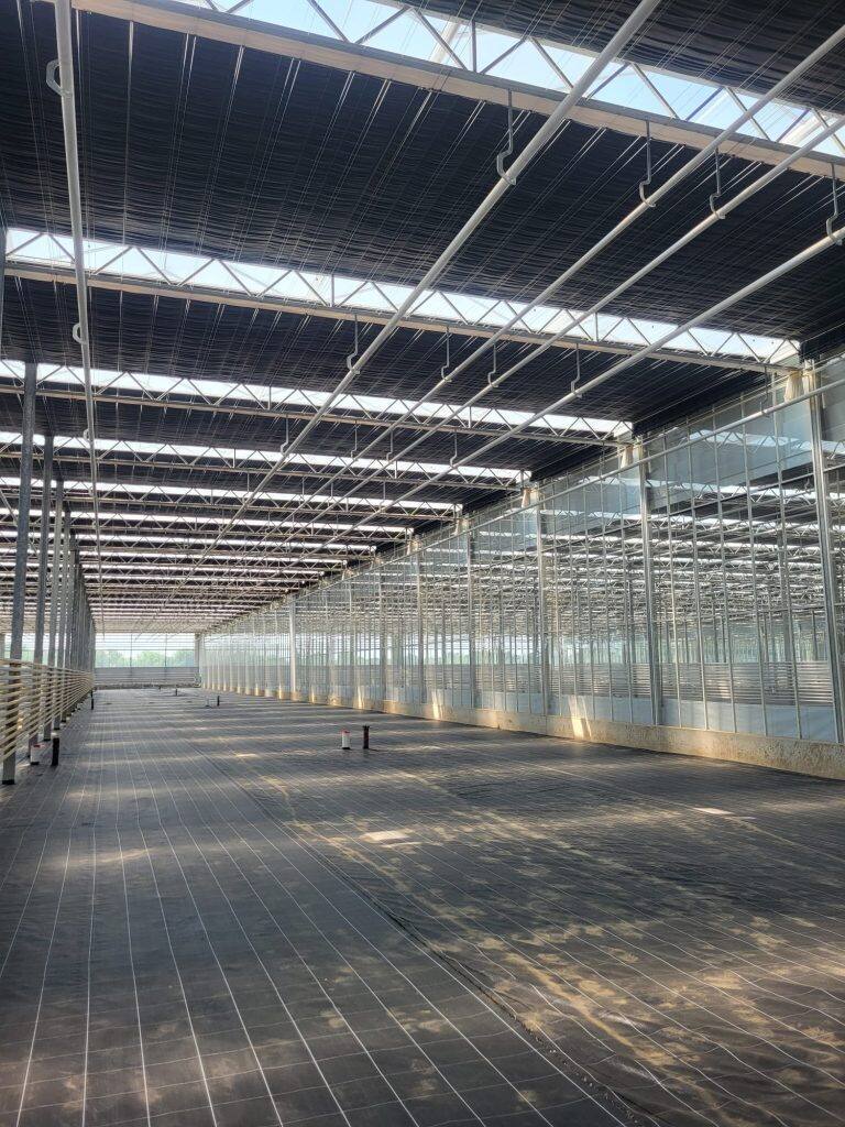Greenhouse screen system installation by VGB Workers