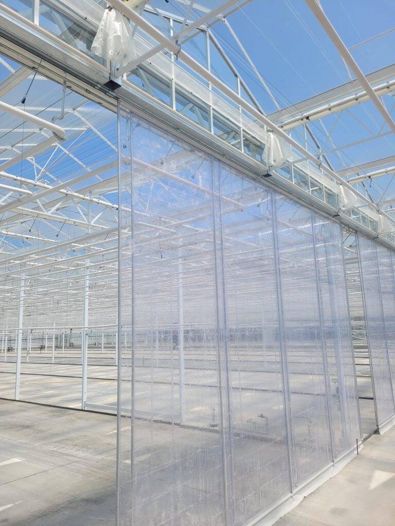 Greenhouse screen system installation by VGB Workers