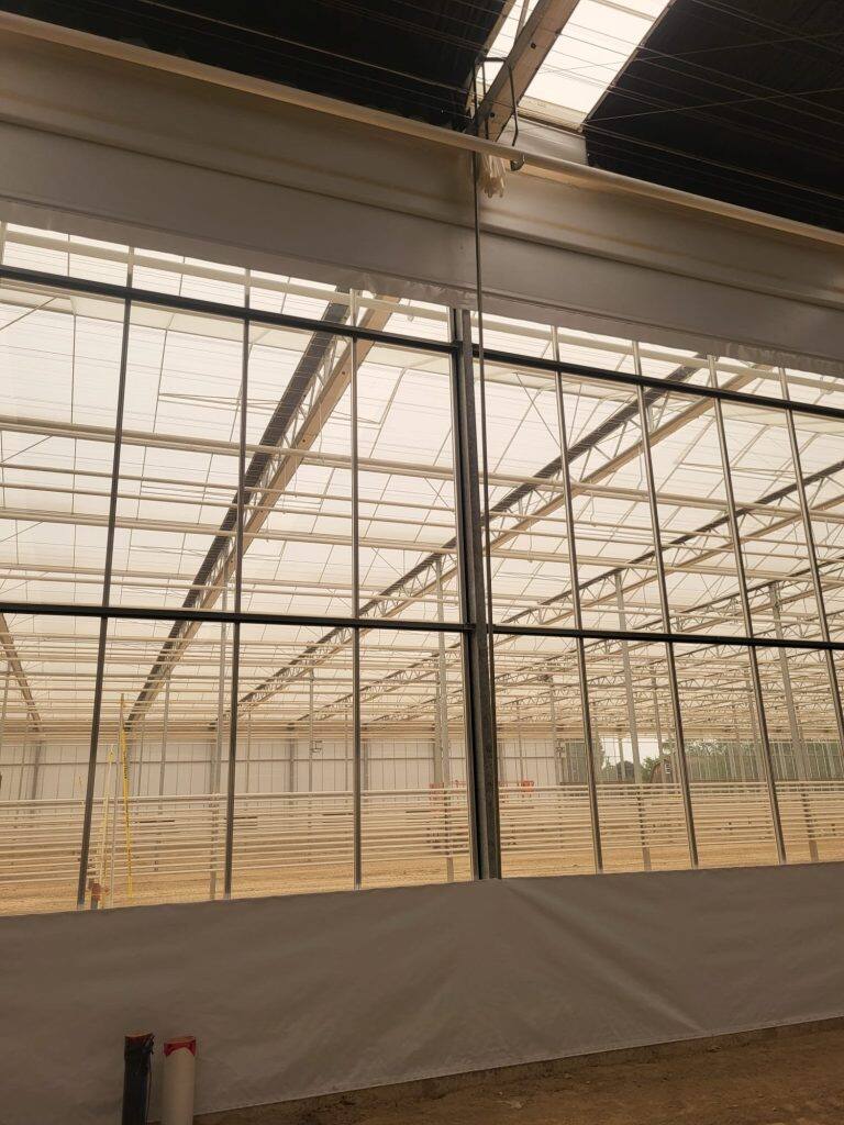 Greenhouse screen system installation by VGB Workers