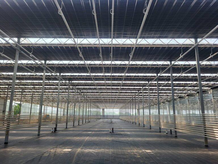 Greenhouse screen system installation by VGB Workers
