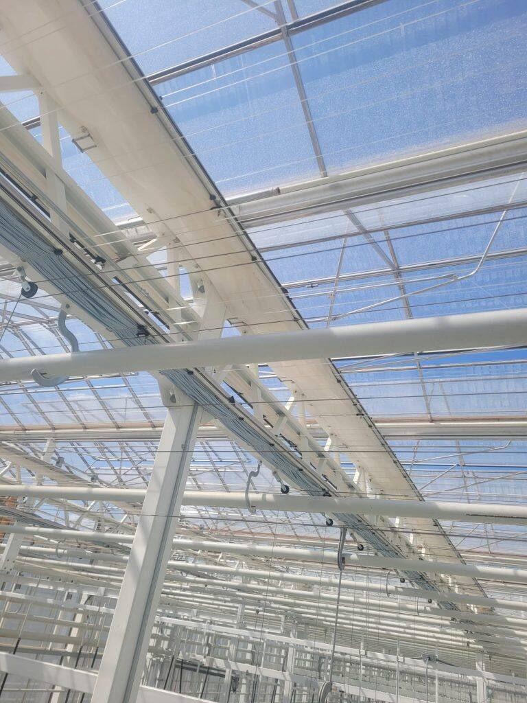 Greenhouse screen system installation by VGB Workers