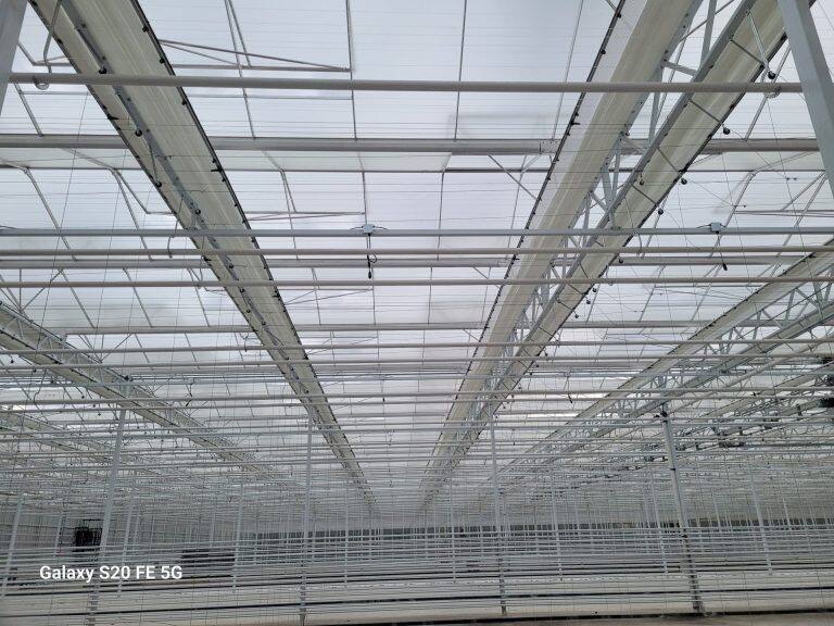 Greenhouse screen system installation by VGB Workers