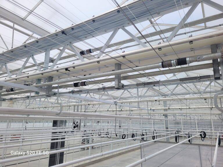 Greenhouse screen system installation by VGB Workers