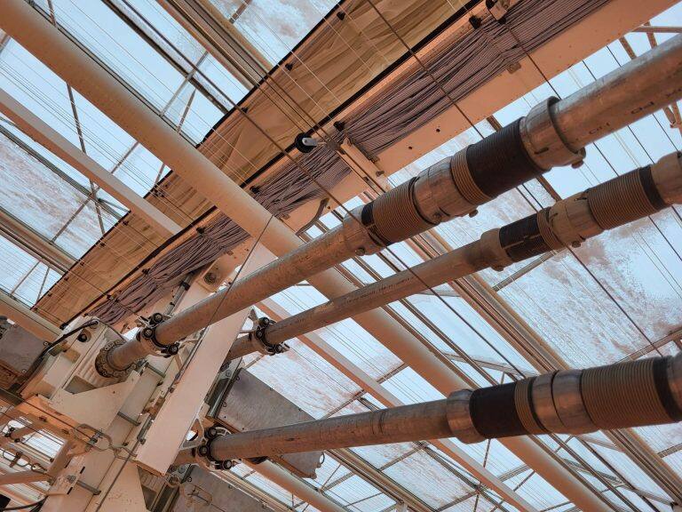 Greenhouse screen system maintenance and curtain replacement