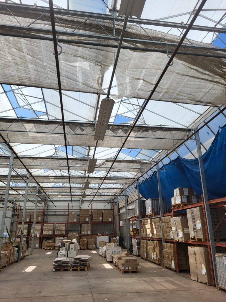 Greenhouse screen system maintenance and curtain replacement